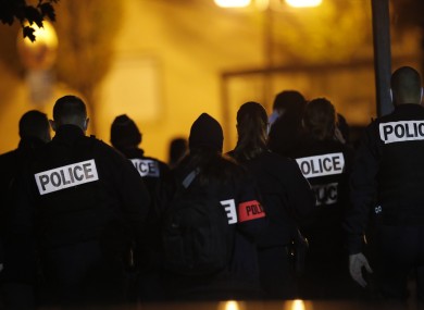 French police officers gather outside the high school in Conflans-Saint-Honorine, north of Paris.