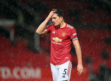 Harry Maguire reacts to United's draw.