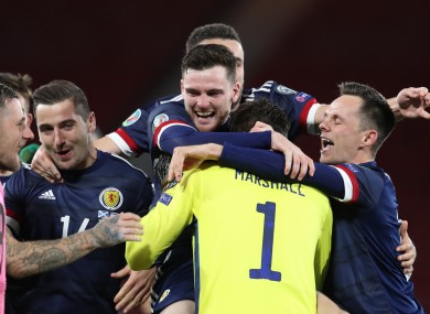 Andy Robertson leads the Scotland celebrations.
