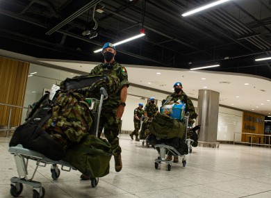 The troops returning to Dublin Airport last night.