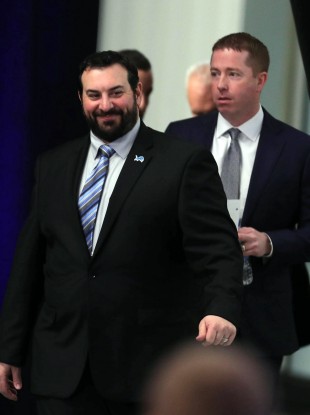 Matt Patricia (L) and Bob Quinn arrive for a press conference in 2018.