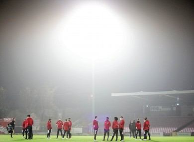 Derry City players inspect the pitch before the game against Cork City.