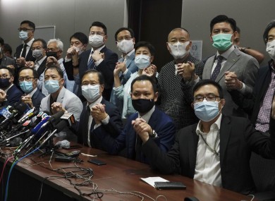 Hong Kong's pro-democracy legislators pose a picture before a press conference at Legislative Council in Hong Kong.