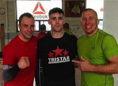 Dean Barry (middle) training alongside former UFC champion Georges St-Pierre (right) at Tristar in Montreal in 2017.