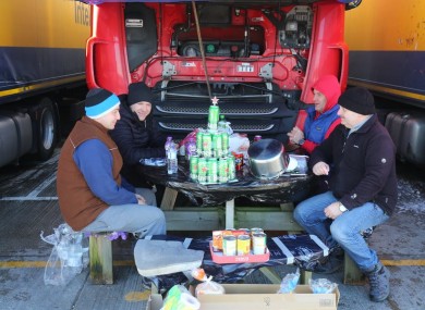 Polish lorry drivers share Christmas Day food and drinks at a truck stop near Folkestone, Kent