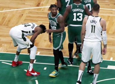 Giannis Antetokounmpo reacts after missing his second free throw with less than a second left on the clock.