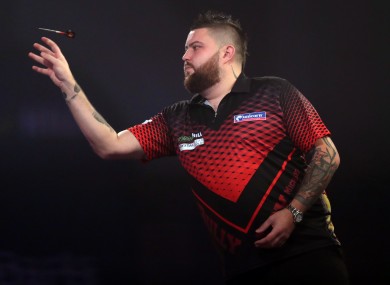 Michael Smith throwing darts this evening.