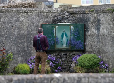 File image of author John Pascal Rodgers at a grotto on the grounds of the unmarked mass grave in Tuam, Co Galway.