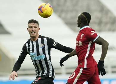 Newcastle United's Ciaran Clark battling for possession with Sadio Mane of Liverpool during Wednesday's goalless draw.