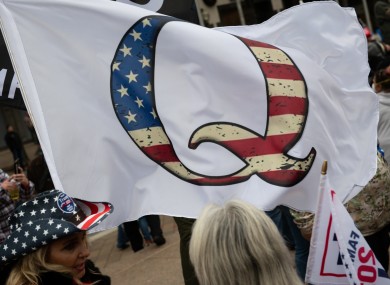 A QAnon flag among pro-Trump demonstrators in Washington DC last Tuesday.