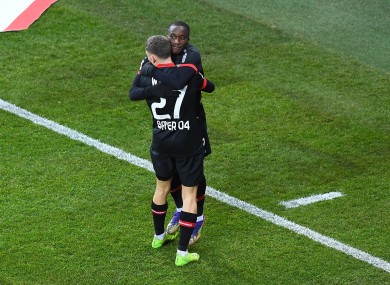 Moussa Diaby and Florian Wirtz celebrate.
