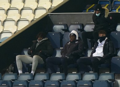 Crystal Palace's Eberechi Eze (left) watches the match from the stands.