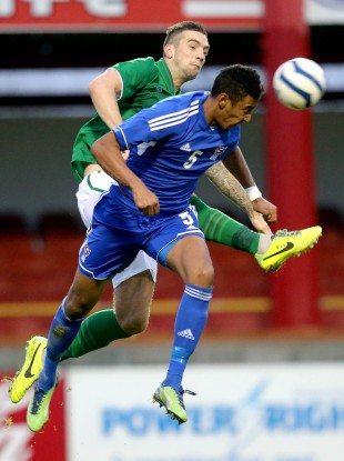 Sonni Ragnar Nattestad challenges Shane Duffy during an U21 international in 2013.