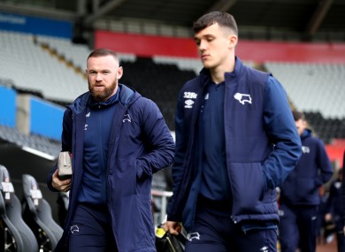 Derby County manager Wayne Rooney and midfielder Jason Knight, who has captained the club recently.