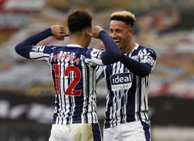 West Bromwich Albion's Matheus Pereira celebrates scoring his side's third goal with Callum Robinson.