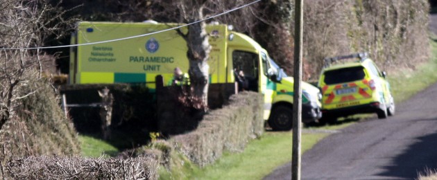 Ambulance crew at the scene near Kilacluig, close to Mitchelstown, after the body of the third brother was found.