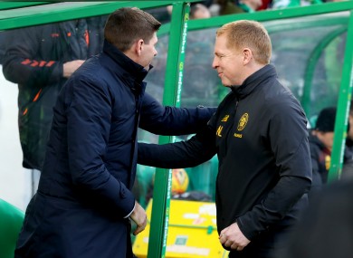Steven Gerrard and Neil Lennon shake hands.