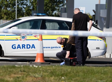 Gardaí investigating the scene after James 'Mago' Gately was shot near Dublin Airport in May 2017.
