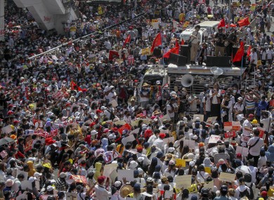 Demonstrators gather in the capital Yangon earlier today
