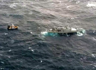 The LÉ George Bernard Shaw towing the ship to safety.