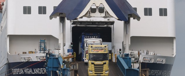 Lorries driving off the European Highlander P&O ferry at the Port of Larne.