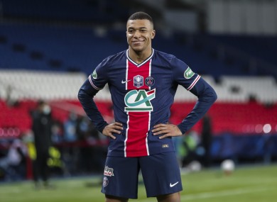 Kylian Mbappe celebrates after scoring PSG's third goal.