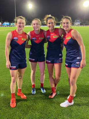 Lauren Magee (second left) celebrates with her Melbourne team-mates.
