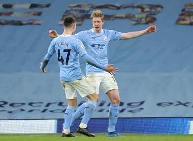 Manchester City's Kevin De Bruyne (right) celebrates with Phil Foden.
