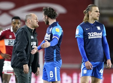 Preston North End's Alan Browne (centre) is sent off for a foul.