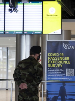 A member of the Defence Forces waits in Dublin Airport
