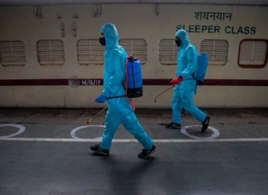 File photo. Health workers sanitising a train.