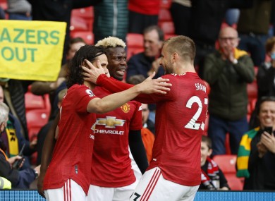 Luke Shaw (R) celebrating Edinson Cavani's goal against Fulham.