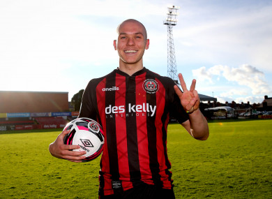 Bohs’ Georgie Kelly celebrates with the match ball after scoring a hat-trick.