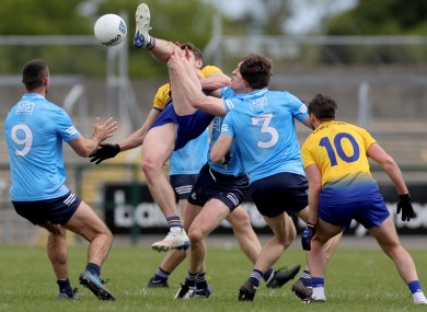 Dublin's James McCarthy, Tom Lahiff and David Byrne with Eddie Nolan of Roscommon.