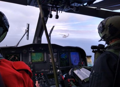 Inside the Irish Air Corps helicopter flying in formation behind the US Seahawk.