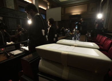 Lawyers stand in front of documents in the courtroom prior to a hearing European Commission vs AstraZeneca, at the main courthouse in Brussels