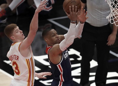 Westbrook (right) shoots past Atlanta's Kevin Huerter.