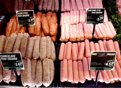 Sausages on display in a supermarket.