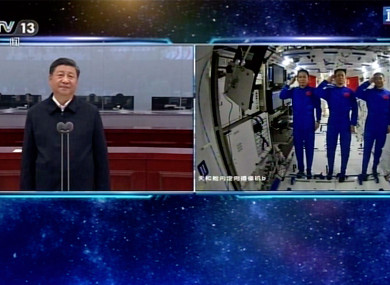 Composite pic showing Chinese astronauts saluting as they talk with Chinese President Xi Jinping