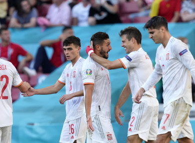 Spain's Cesar Azpilicueta, 2nd right, celebrates after scoring.