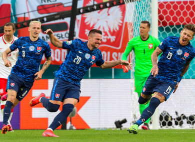 Slovakia's Robert Mak (centre) celebrates his goal.