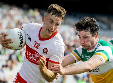 Derry's Shane McGuigan and Eoin Rigney of Offaly.