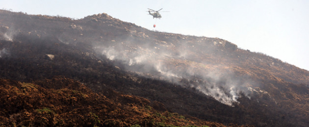 An Air Corps helicopter fire fighting in Howth.