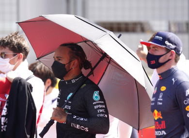 Mercedes' Lewis Hamilton (middle) and Red Bull's Max Verstappen (R) prior to the start of the British Grand Prix.