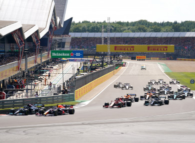 Max Verstappen and Lewis Hamilton leading the race during the British Grand Prix.