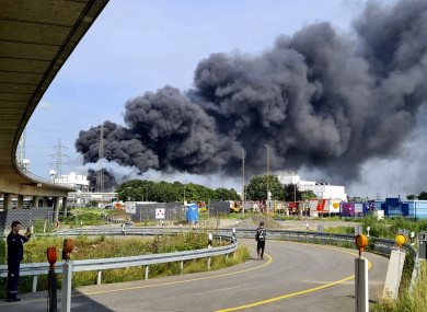 A dark cloud of smoke rises into the air in Leverkusen, Germany (Mirko Wolf/dpa via AP)