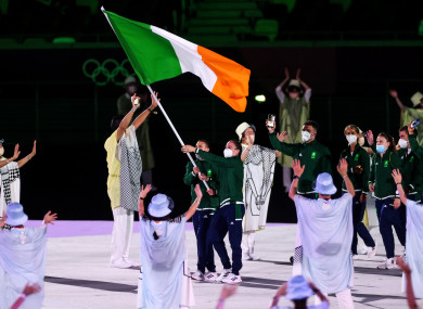 Kellie Harrington and Brendan Irvine carry the flag for Team Ireland.