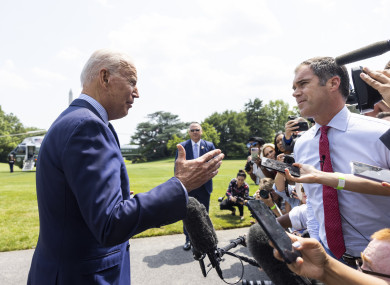 Biden speaks briefly with the media as he departs the White House for a weekend in Cape David