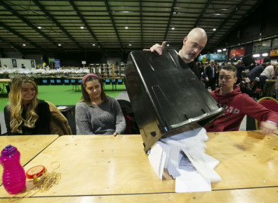 Count staff emptying ballot boxes for counting at the RDS in Dublin in February 2020.