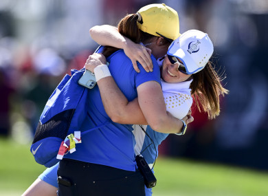 Leona Maguire celebrates with sister Lisa after beating Jennifer Kupcho.